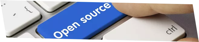 A keyboard with the right Shift key replaced by a blue one with 'Open Source' written on it